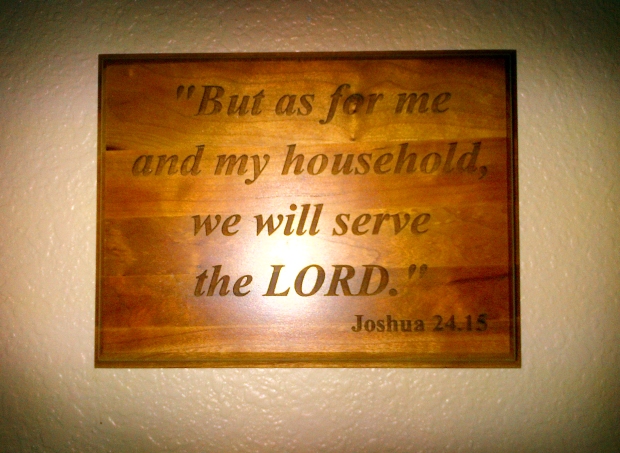 Wall plaque with Joshua 24:15 engraved on it.